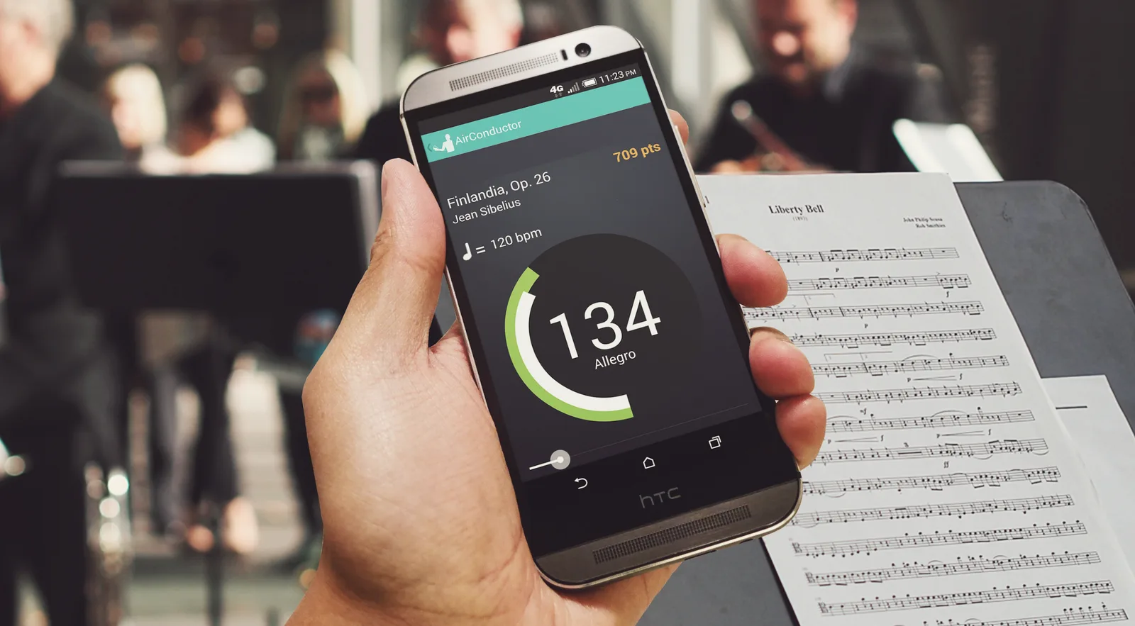 Air Conductor on a phone in front of an orchestra's music stand, conducting Sibelius's Finlandia at 134 bpm (Allegro)